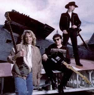 The Sky Kings posed with oversized stringed instruments